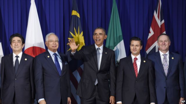 FILE - President Barack Obama (c) and other leaders of the Trans-Pacific Partnership countries pose for a photo in Manila, Philippines, Nov. 18, 2015 / Photo Source: VoA