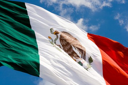Mexican flag in blue sky
