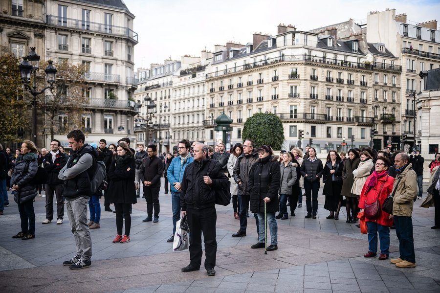 People gather to hold a minute of silence in front of the Paris city Hall, France, on Monday. Photo Credit: Christophe Petit Tesson /EPA /LANDOV
